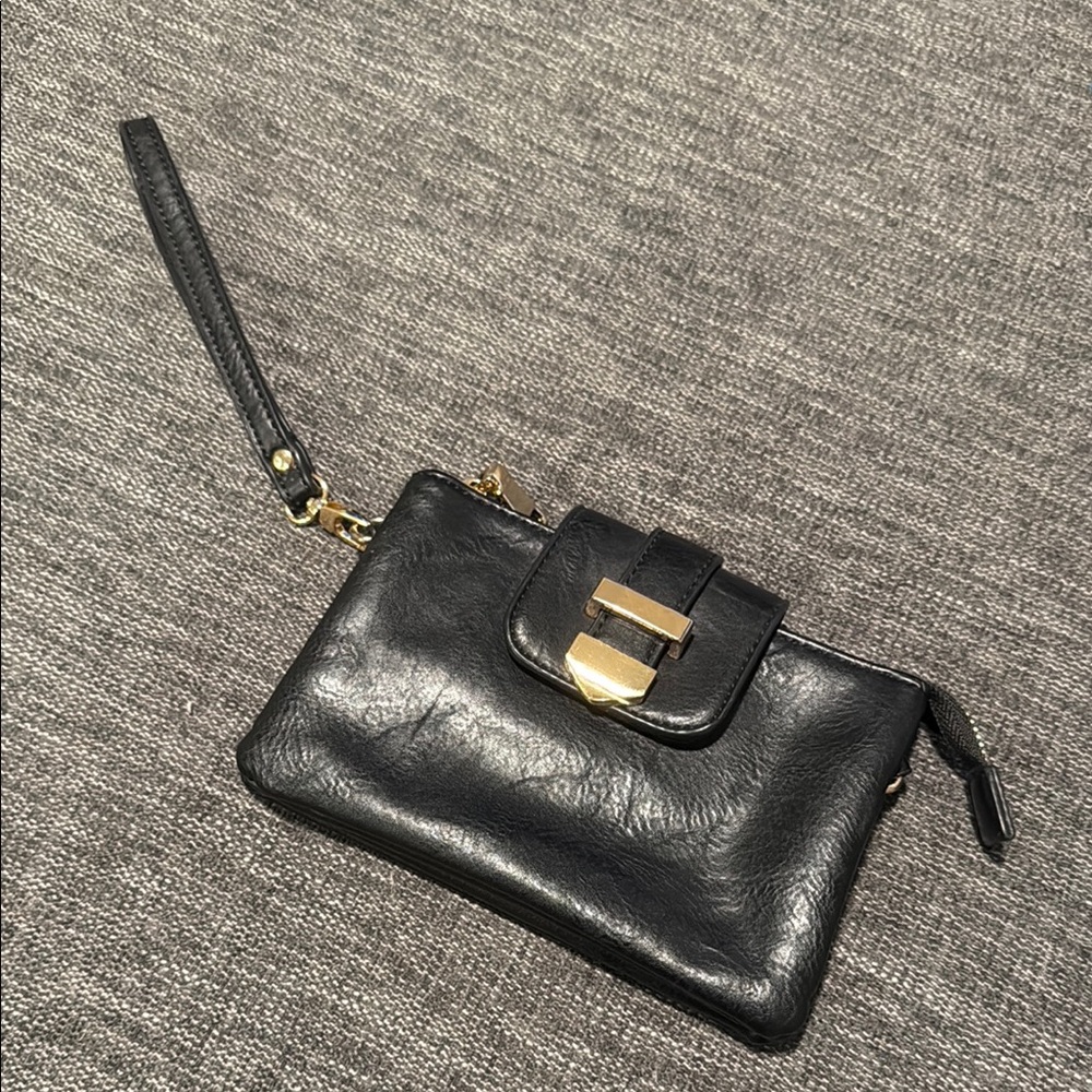 Madison West Black and Gold Clutch with Sleek Design